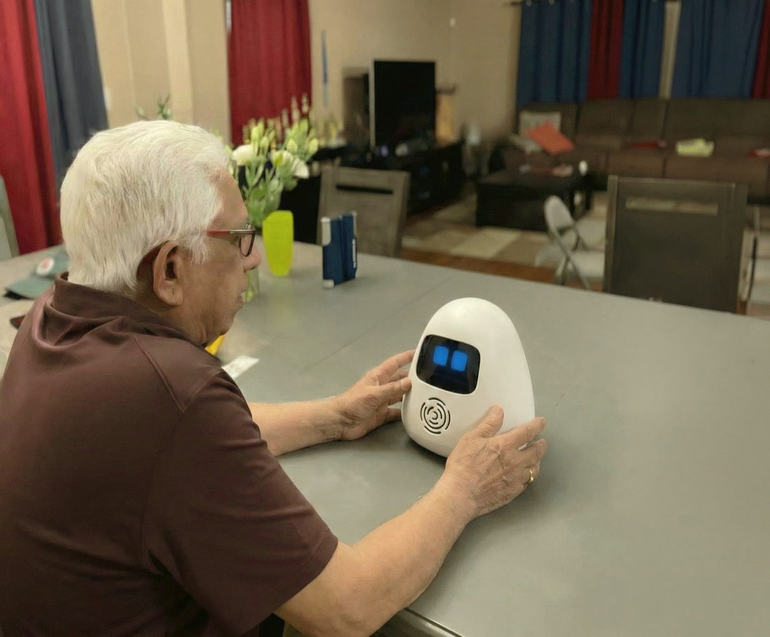 A grandfather talking with Sam at home