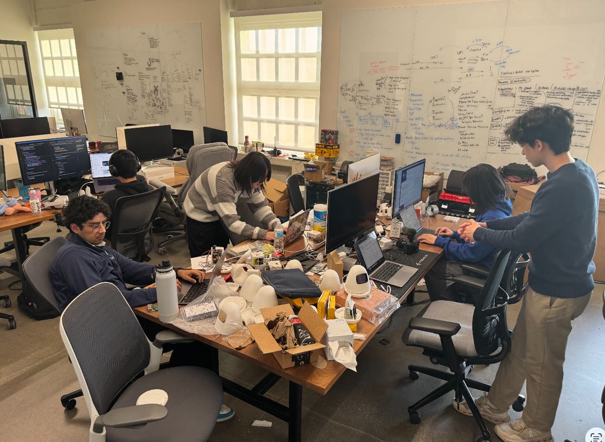 The Sam team building early robots together in the office.